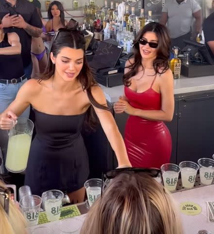 <p>Marqueelv/Instagram</p> Kendall (left) and Kylie Jenner tend bar at the event