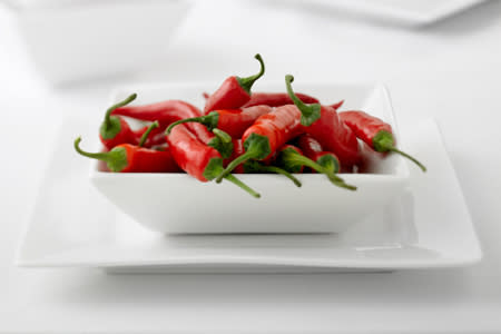 <p>Adding a bit of heat to your diet can give you a weight-loss boost. Studies show that eating chillies as a part of your breakfast can make you opt for a smaller lunch. Apparently it's down to capsaicin, which has appetite suppressing properties. Granted — chillies aren't the easiest of items to face as your morning meal but how about as a part of a spicy egg-white omelette or stirred into scrambled eggs for a spicy weight loss kick.</p>