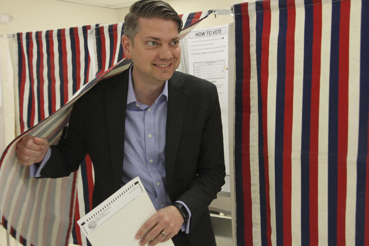 Nick Begich, a Republican candidate in both the special election and regular primary for Alaska's open U.S. House seat, emerges from a booth after voting Wednesday, Aug. 10, 2022, in Anchorage, Alaska. Begich is in two elections on Tuesday. He is one of three candidates in a special election vying to fill the remainder of U.S. Rep. Don Young's term after he died in March. He is also in the U.S. House primary, seeking a full two-year term. (AP Photo/Mark Thiessen, File)