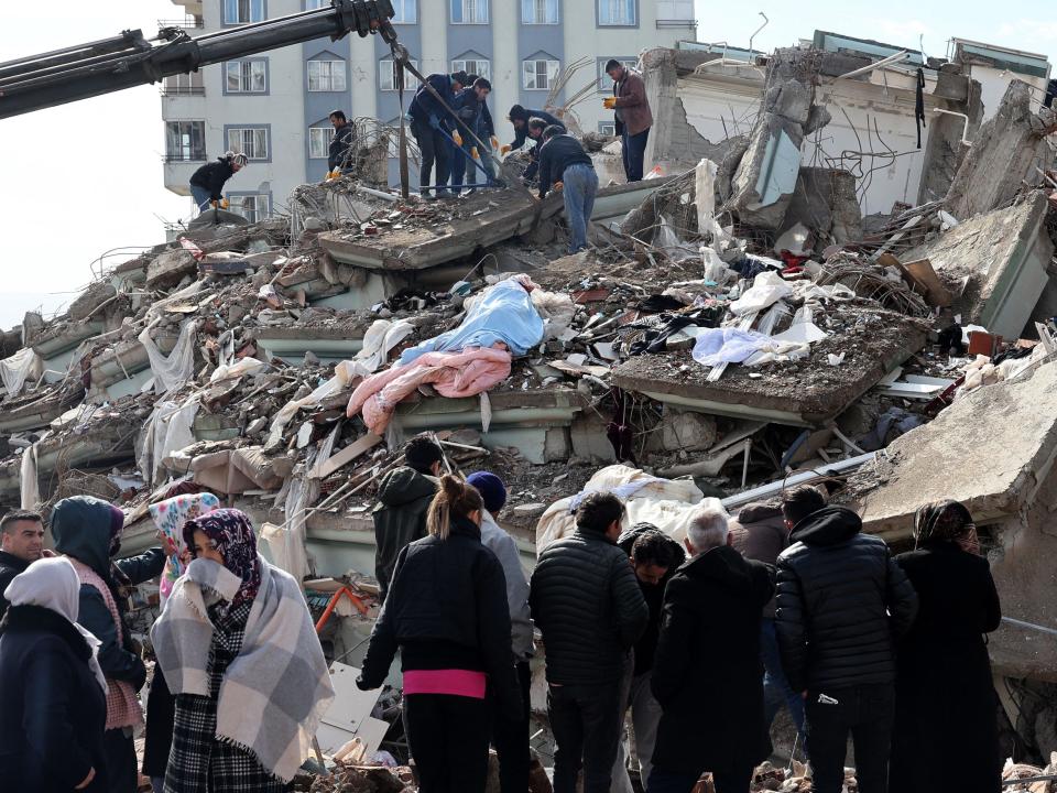 Rescuers and civilians look for survivors under the rubble of collapsed buildings in Kahramanmaras, Turkey. A 7.8-magnitude earthquake struck the country's southeast on February 7, 2023.