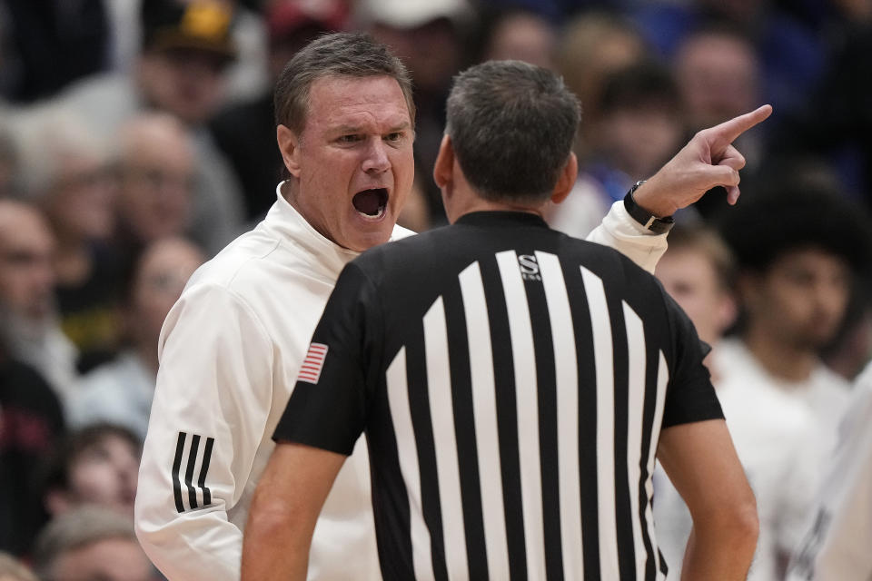 Kansas head coach Bill Self talks to an official during the first half of an NCAA college basketball game against Missouri Saturday, Dec. 9, 2023, in Lawrence, Kan. (AP Photo/Charlie Riedel)