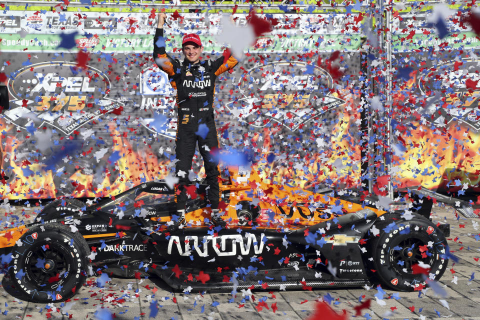 Pato O'Ward celebrates his victory at an IndyCar Series auto race at Texas Motor Speedway on Sunday, May 2, 2021, in Fort Worth, Texas. (AP Photo/Richard W. Rodriguez)