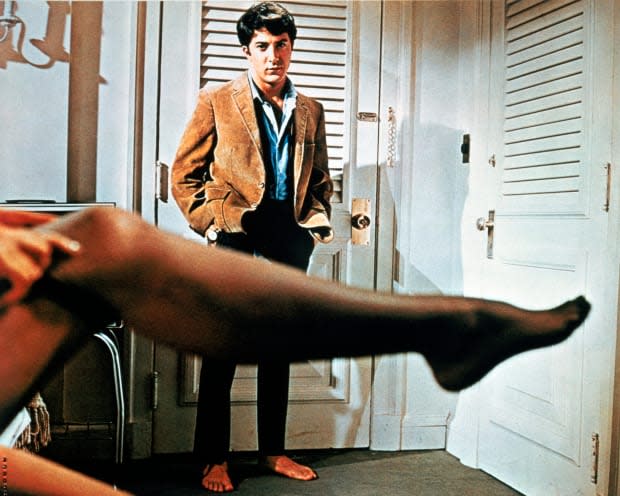 Dustin Hoffman as Benjamin Braddock, watching his older lover Mrs. Robinson (Anne Bancroft) get dressed in a promotional still from the film "The Graduate"<p><a href="https://www.gettyimages.com/detail/1287403235" rel="nofollow noopener" target="_blank" data-ylk="slk:Silver Screen Collection/Getty Images;elm:context_link;itc:0;sec:content-canvas" class="link ">Silver Screen Collection/Getty Images</a></p>