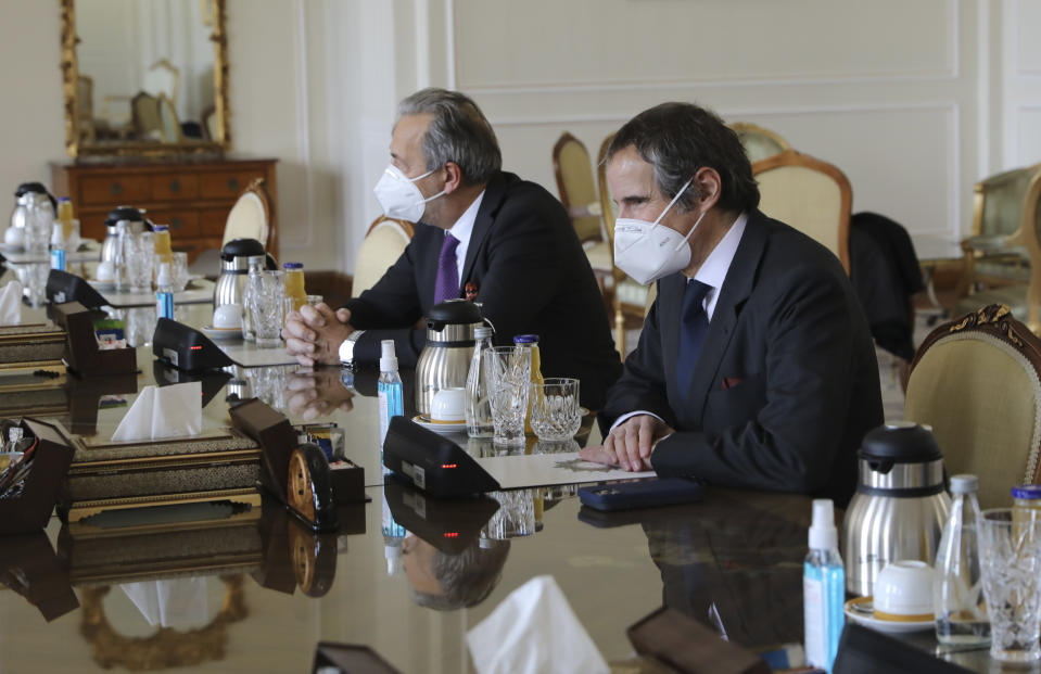 Director General of International Atomic Energy Agency, IAEA, Rafael Mariano Grossi, right, looks towards Iranian Foreign Minister Mohammad Javad Zarif during a meeting, in Tehran, Iran, Sunday, Feb. 21, 2021. The head of the United Nations' nuclear watchdog met Sunday with Iranian officials in a bid to preserve his inspectors' ability to monitor Tehran's atomic program, even as authorities said they planned to cut off surveillance cameras at those sites. (AP Photo)