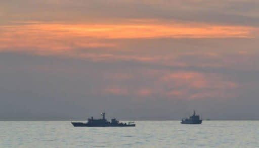 A Philippine navy photo shows Chinese surveillance ships off Scarborough Shoal, on April 11. Chinese fishing boats involved in a standoff with the Philippines have left a disputed shoal in the South China Sea, leaving just one of Beijing's ships in the area, according to Philippine officials