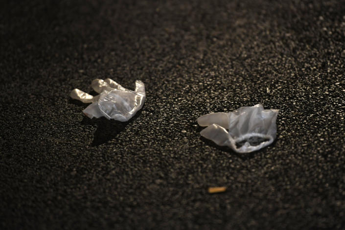 Gloves used by emergency services who helped the victims lie on the pavement after a deadly shooting took place in Strasbourg, France, early Dec.12, 2018. (Photo: Patrick Seeger/EPA-EFE/REX/Shutterstock)