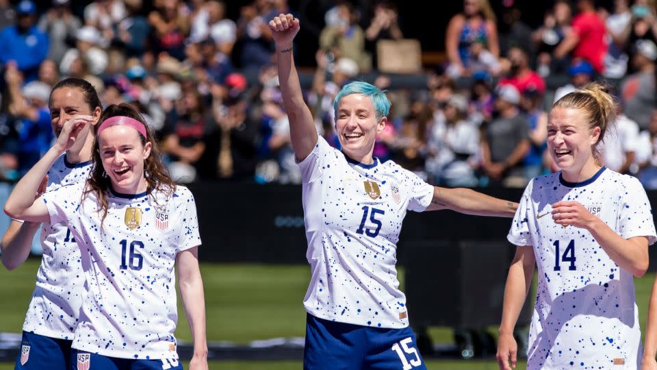 Rapinoe (center) celebrates with teammates after facing Wales before the start of the World Cup. - John Hefti/USA Today Network/Reuters