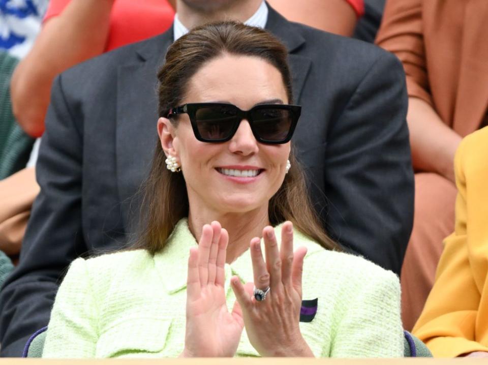 catherine, princess of wales attends day thirteen of the wimbledon tennis championships wearing a tennis green dress and sunglasses