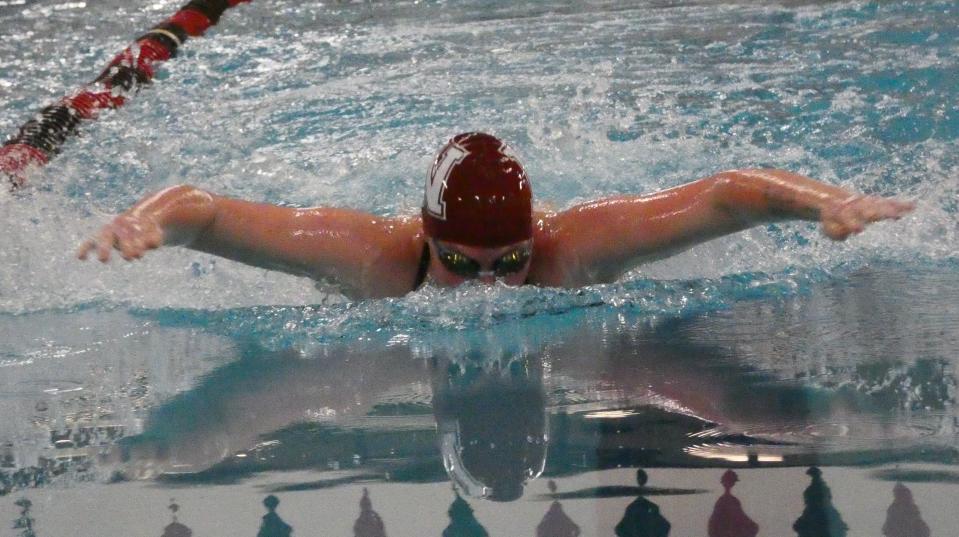 Newark senior Halen Swickard swims in the 100 butterfly during a meet against Lakewood, Central Crossing and West Muskingum at the Licking County Family YMCA on Friday, Jan. 14, 2022.