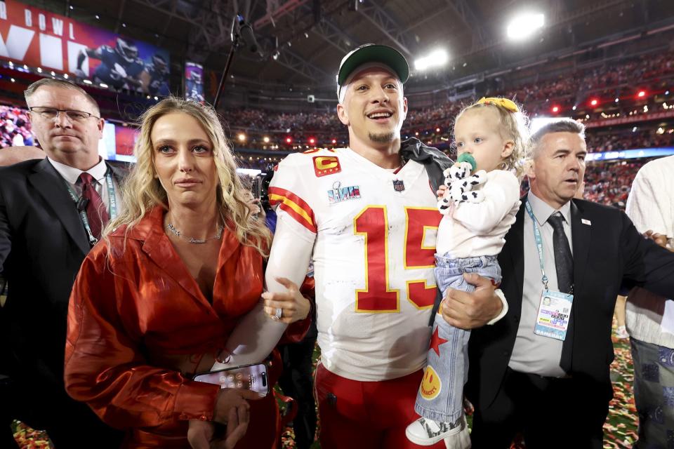 Patrick Mahomes #15 of the Kansas City Chiefs celebrates with his wife Brittany Mahomes and daughter Sterling Skye Mahomes after the Kansas City Chiefs beat the Philadelphia Eagles in Super Bowl LVII at State Farm Stadium on February 12, 2023 in Glendale, Arizona.