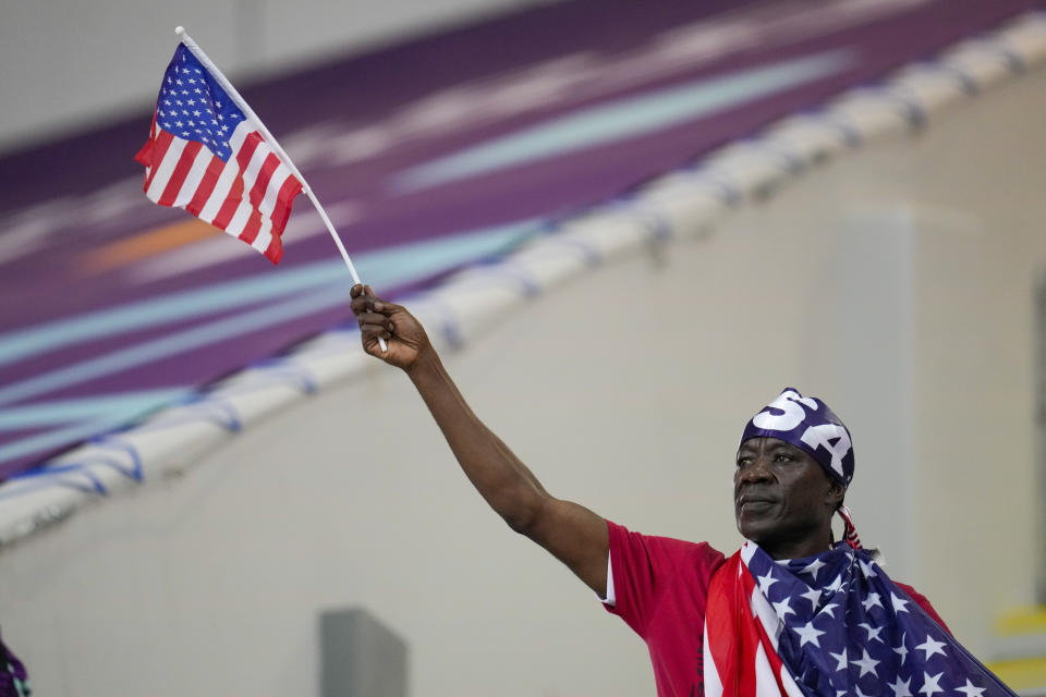 A fan waits for the World Cup round of 16 soccer match between the Netherlands and the United States, at the Khalifa International Stadium in Doha, Qatar, Saturday, Dec. 3, 2022. (AP Photo/Ashley Landis)