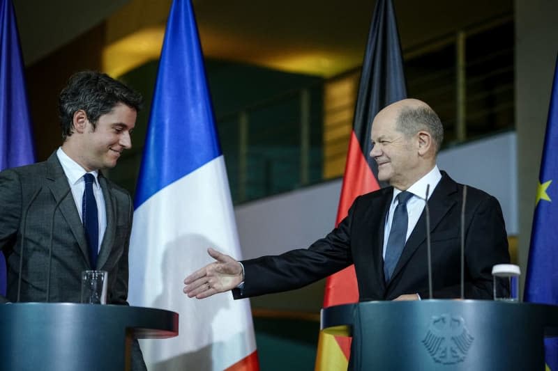 German Chancellor Olaf Scholz shakes hands with French Prime Minister Gabriel Attal after their joint press conference at the German Chancellery. Kay Nietfeld/dpa