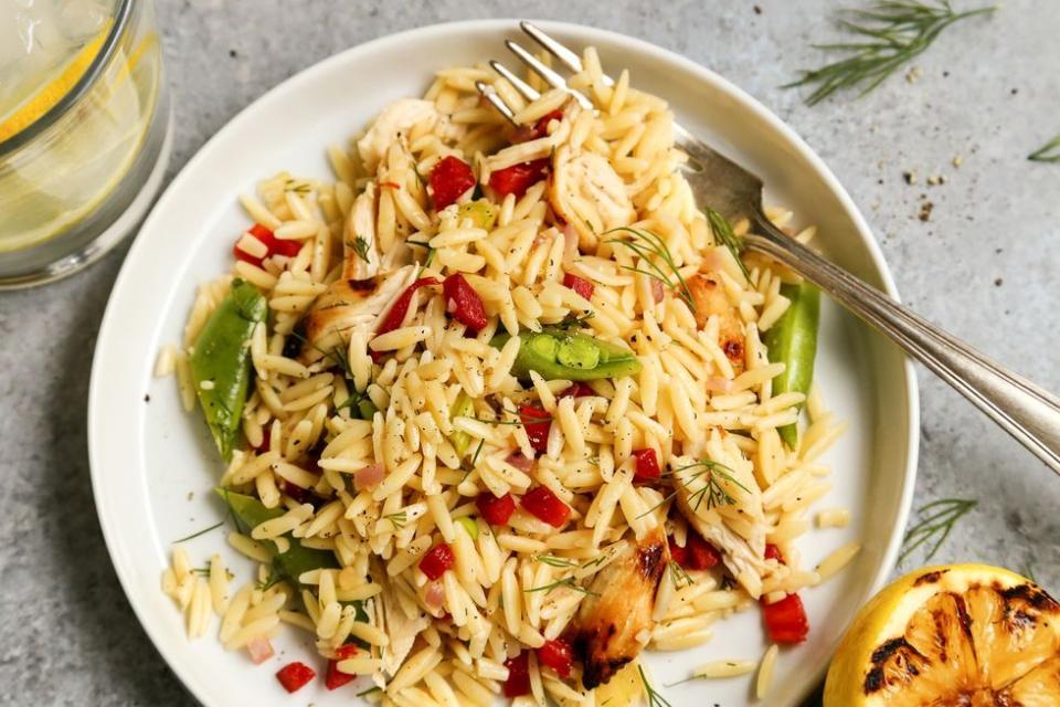 grilled chicken and lemon orzo pasta salad on white plate