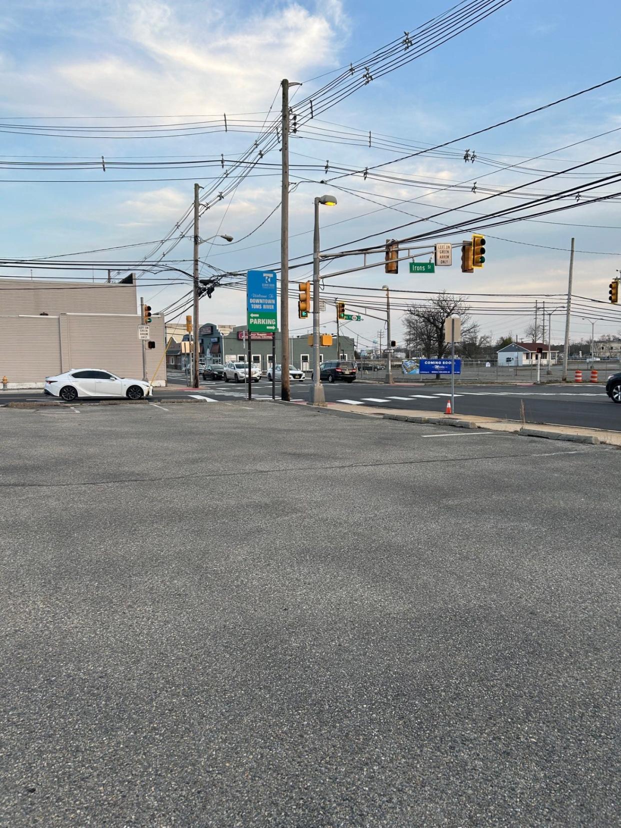 A four-story building with 64 residences and commercial space on the first floor has been proposed for this parking lot at West Water and Irons streets in Toms River.