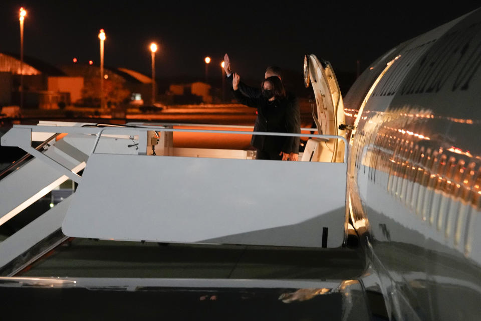 Vice President Kamala Harris and her husband Doug Emhoff waves as they board Air Force Two en route to Paris, at Andrews Air Force Base, Md., Monday, Nov. 8, 2021. (Sarahbeth Maney/The New York Times via AP, Pool)