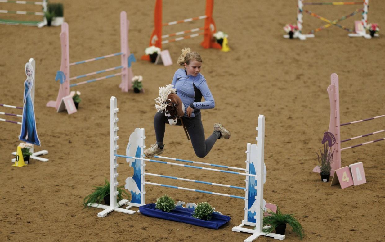 Hobby horse competitions feature young enthusiasts trotting, galloping, and cantering on toy horses in various disciplines