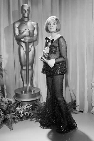 Bettmann/Getty Barbra Streisand wears a sheer sequin pantsuit by Arnold Scaasi as she holds her first Academy Award