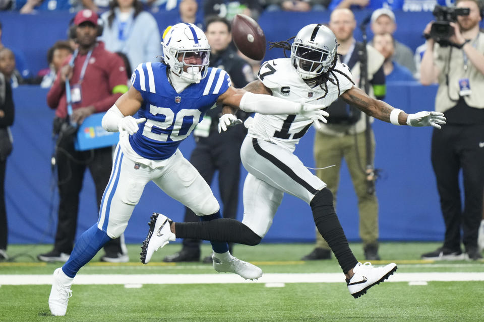 Indianapolis Colts safety Nick Cross (20) breaks up a pass intended for Las Vegas Raiders wide receiver Davante Adams (17) during the first half of an NFL football game Sunday, Dec. 31, 2023, in Indianapolis. (AP Photo/AJ Mast)