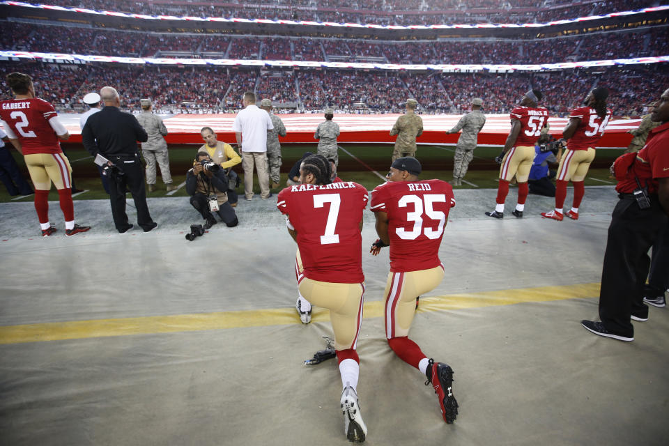 SANTA CLARA, CA - SEPTEMBER 12: Eric Reid #35 and Colin Kaepernick #7 of the San Francisco 49ers kneel during the anthem prior to the game against the Los Angeles Rams at Levi Stadium on September 12, 2016 in Santa Clara, California. The 49ers defeated the Rams 28-0. (Photo by Michael Zagaris/San Francisco 49ers/Getty Images)  *** Local Caption ***