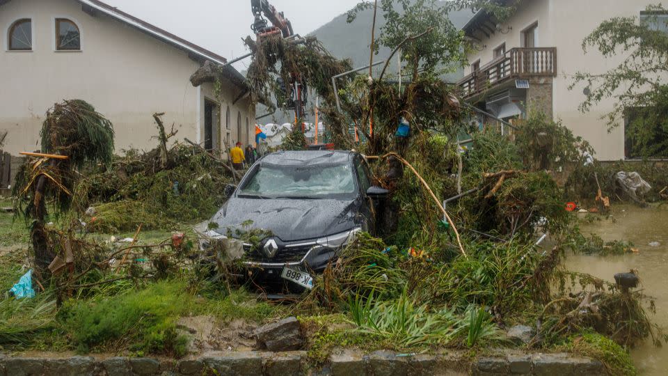 A destroyed car in the yard of a house that was flooded by the Savinja River in Nazarje, Slovenia. - Matej Povse/Getty Images