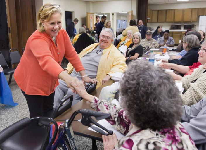 Democratic Sen. Mary Landrieu greets residents at a home for the elderly and disabled in Houma, Louisiana November 25, 2014. Landrieu faces Republican Bill Cassidy in a December 6 run-off election. (REUTERS/Lee Celano)