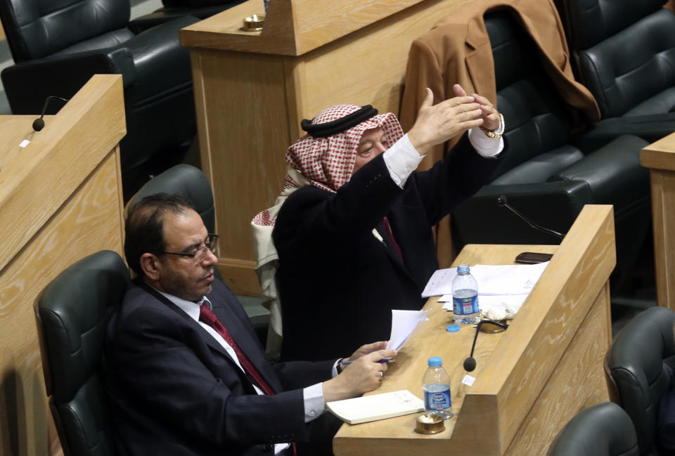 Jordanian lawmakers attend the second day of a heated debate on the U.S. push for a peace deal between Israelis and Palestinians, under the domed parliament chamber in the capital, Amman, Jordan, Tuesday, Feb. 4, 2014. The kingdom is already home to the largest Palestinian population outside the West Bank and Gaza Strip, and Jordanian lawmakers and others fear the Palestinians will be coerced into an accord that gives up land and leads to a new influx of refugees into Jordan. (AP Photo)