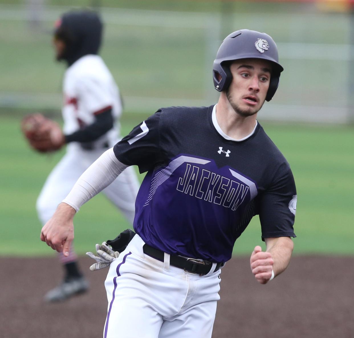 Garrett Wright of Jackson rounds third base on his way home to score during their game at McKinley on Tuesday, April 26, 2022.