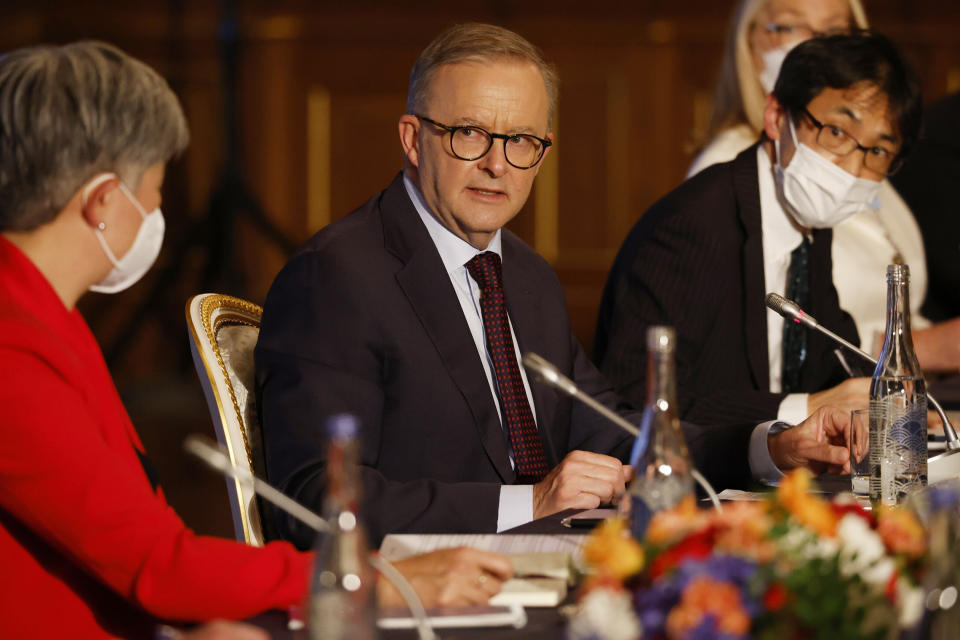 Australian Prime Minister Anthony Albanese, center, flanked by Foreign Minister Penny Wong, left, attends a bilateral meeting with Japanese Prime Minister Fumio Kishida (not seen), alongside the Quad leaders' summit, between the United States, Japan, India and Australia, at the Akasaka Palace state guest house in Tokyo, Tuesday, May 24, 2022. (Issei Kato/Pool Photo via AP)