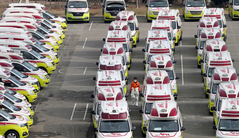 Ambulances to transport coronavirus infected patients are parked in Daegu