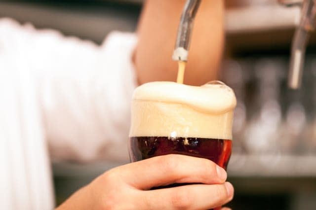 detail of a bartender drawing a ...