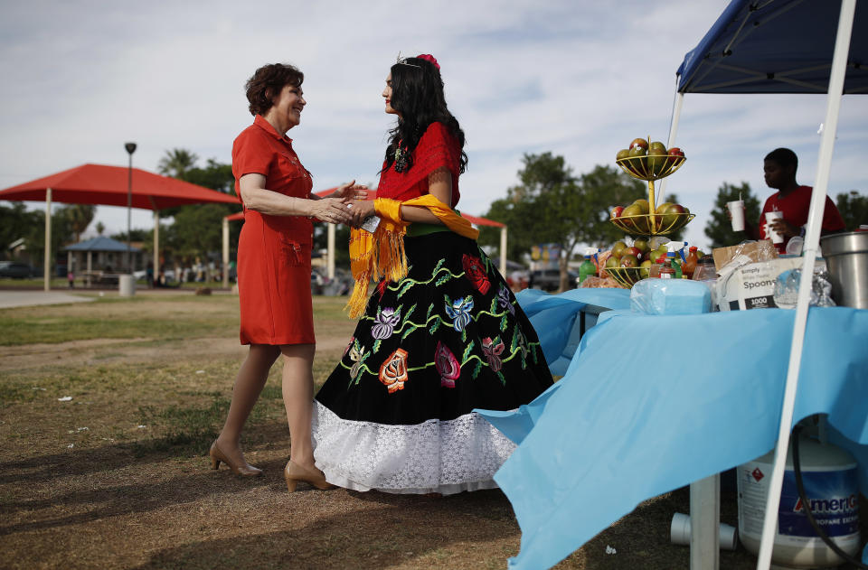 Rep. Jacky Rosen, D-Nev., left, meets Giselle Rodriguez at a Cinco de Mayo festival in North Las Vegas, Nev. (Photo: John Locher/AP)