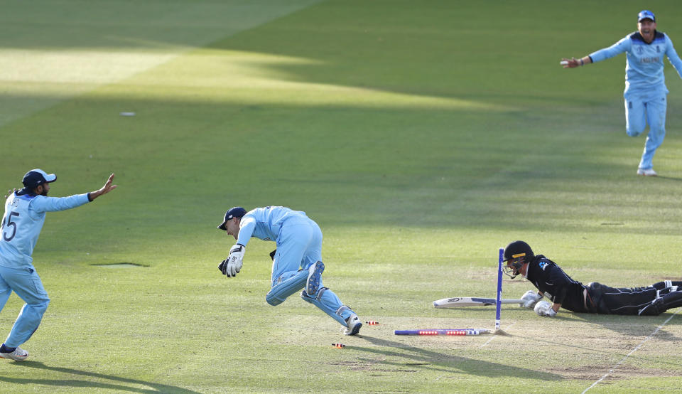 Jos Buttler runs out New Zealand's Martin Guptill to win the Cricket World Cup (AP Photo/Alastair Grant)