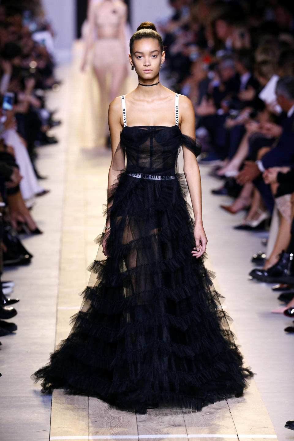 <p>A number of floor-length gowns boasted semisheer bralette tops attached to ribbon straps emblazoned with the label’s name. (Photo: Getty Images) </p>