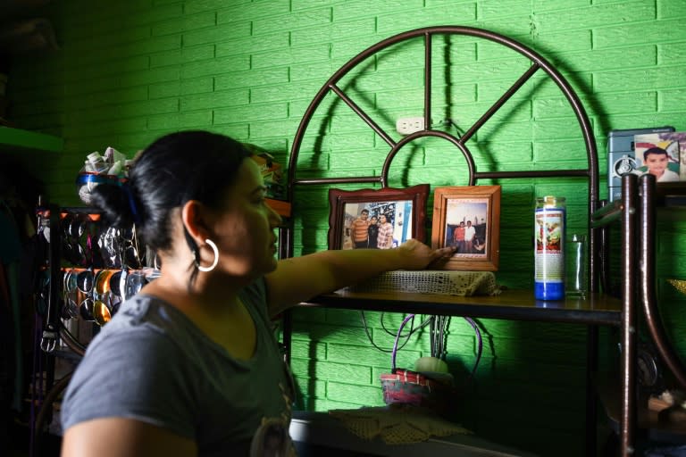 Basilia Bonastre points at a photo of her missing son Arturo, at her house in Jose Cardel, Mexico's Veracruz state