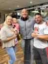 (Left to right) Alicia Carrera with baby Destiny, Dwayne Johnson also known as The Rock and Craie Carrera inside World Fitness Gym in Doncaster