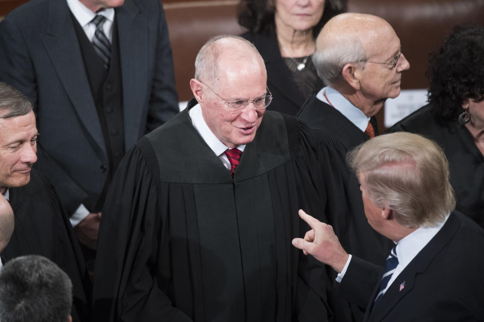 President Donald Trump greets Supreme Court Justice Anthony Kennedy after addressing a joint session of Congress in the Capitol's House chamber in 2017. (Tom Williams/CQ Roll Call via Getty Images)