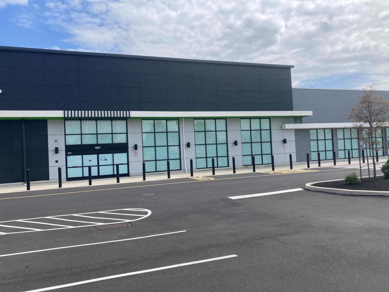The never-opened location of an Amazon Fresh grocery store in Bensalem as seen on April 24, 2024. The familiar neon-green sign for the store has been removed and there appears to be no activity on the property.
