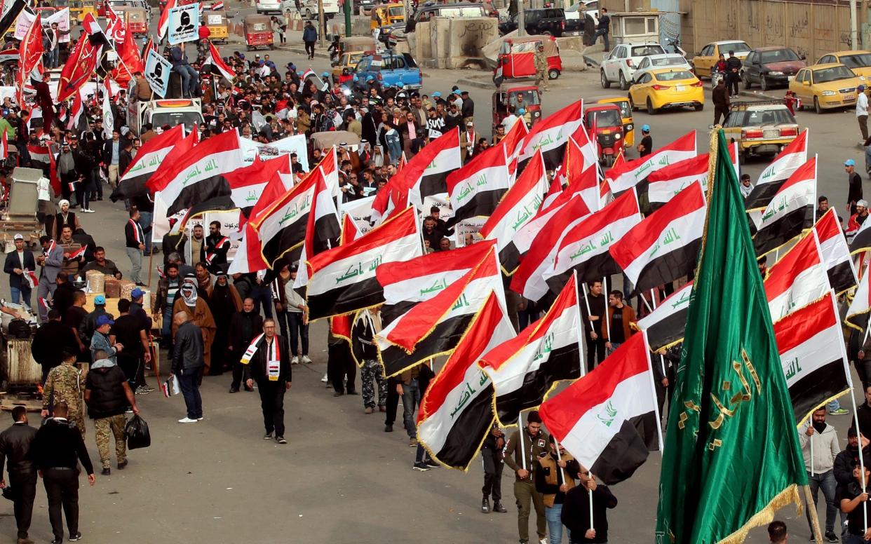 Protesters in Tahrir Square, Baghdad, Iraq, earlier on Friday  - AP