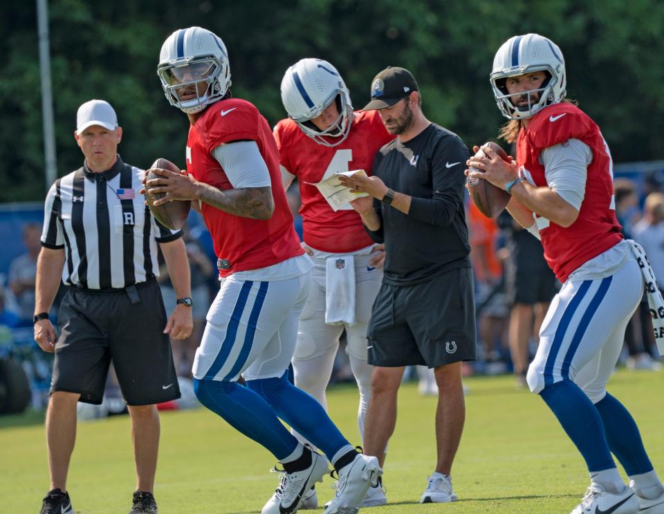 Indianapolis Colts quarterbacks Anthony Richardson (5), from left in red jerseys, <a class="link " href="https://sports.yahoo.com/nfl/players/33606" data-i13n="sec:content-canvas;subsec:anchor_text;elm:context_link" data-ylk="slk:Sam Ehlinger;sec:content-canvas;subsec:anchor_text;elm:context_link;itc:0">Sam Ehlinger</a> (4) and <a class="link " href="https://sports.yahoo.com/nfl/players/32010" data-i13n="sec:content-canvas;subsec:anchor_text;elm:context_link" data-ylk="slk:Gardner Minshew;sec:content-canvas;subsec:anchor_text;elm:context_link;itc:0">Gardner Minshew</a> II (10) run drills during Colts Camp practice at Grand Park, Tuesday, Aug. 1, 2023 in Westfield.