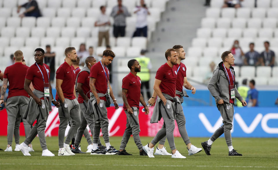 <p>The England team inspects the pitch prior the group G match </p>