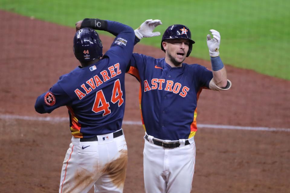 Alex Bregman celebrates his two-run homer in the fifth inning with Yordan Alvarez.