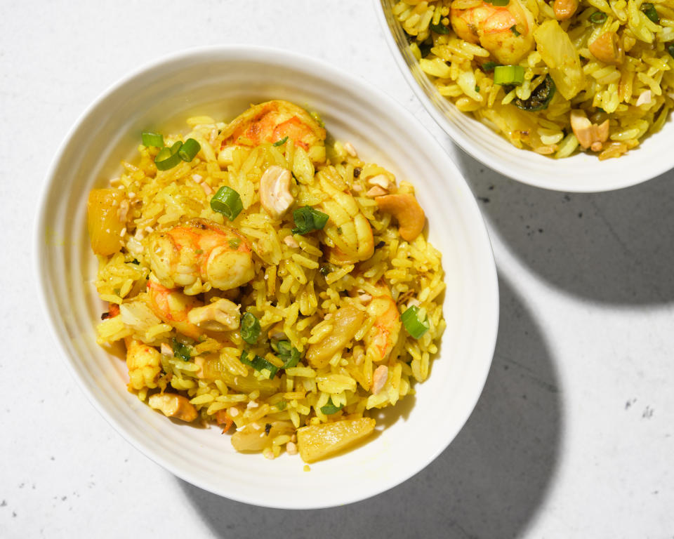 This image released by Milk Street shows a recipe for curried fried rice with shrimp and pineapple. (Milk Street via AP)