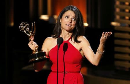 Julia Louis-Dreyfus accepts the award for Outstanding Lead Actress In A Comedy Series for her role in HBO's "Veep" onstage during the 66th Primetime Emmy Awards in Los Angeles, California August 25, 2014. REUTERS/Mario Anzuoni