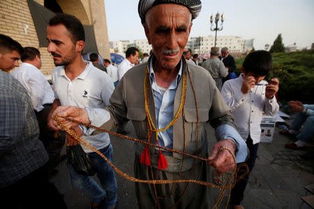 A Kurdish man sells beads at a market in Erbil, Iraq, August 17, 2017. REUTERS/Azad Lashkari