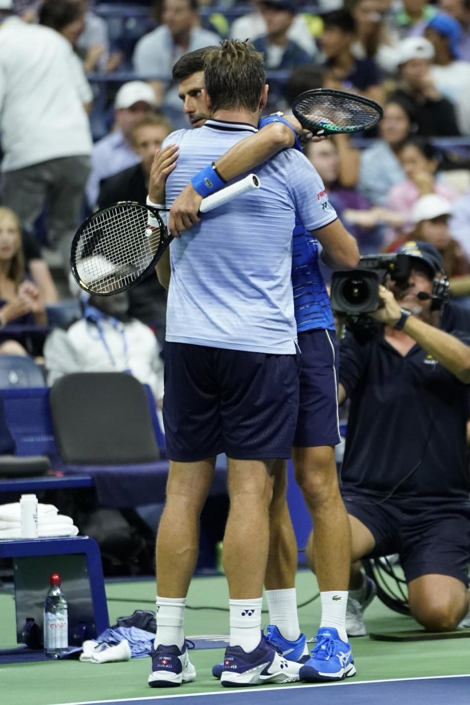 Novak Djokovic, of Serbia, facing, hugs Stan Wawrinka, of Switzerland, as Djokovic retires during the U.S. Open tennis championships, Sunday, Sept. 1, 2019, in New York. (AP Photo/Eduardo Munoz Alvarez)