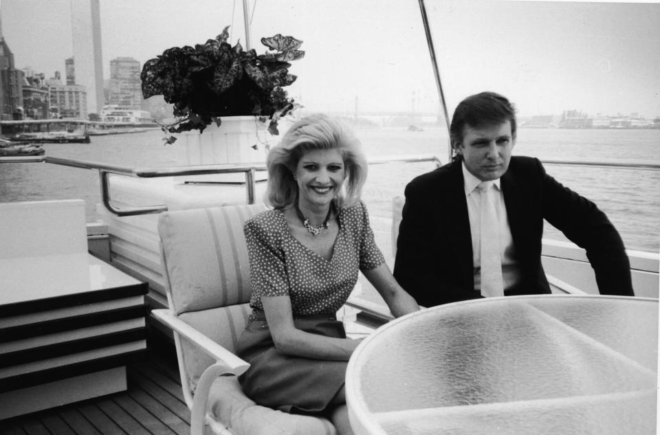 Ivana and Donald Trump sit at a table aboard their luxury yacht The Trump Princess, anchored outside the Water Club in New York in July 1988.