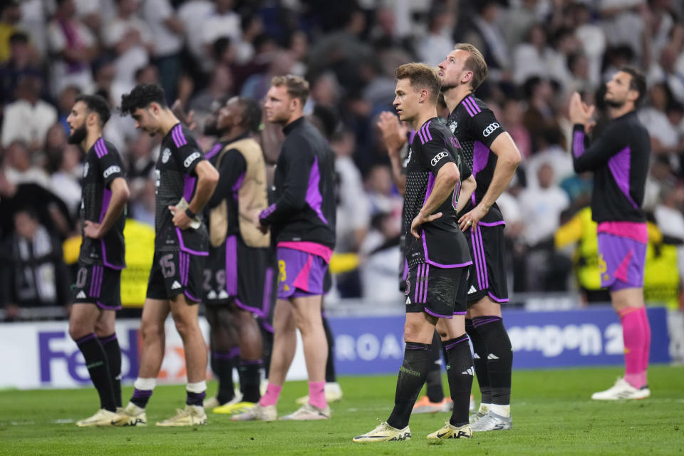 Bayern Munich players react at the end of the Champions League semifinal second leg soccer match between Real Madrid and Bayern Munich at the Santiago Bernabeu stadium in Madrid, Spain, Wednesday, May 8, 2024. (AP Photo/Manu Fernandez)