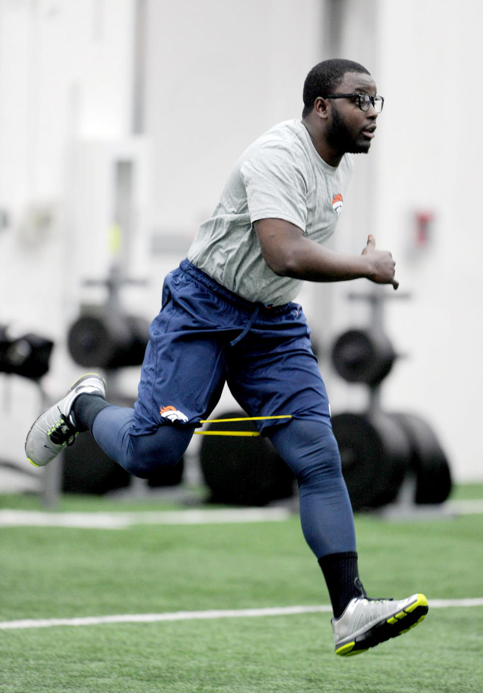 This photo provided by the Denver Broncos shows running back Monte Ball working out during an offseason training session at the NFL football teams training facility in Englewood, Colo., on Monday, April 21, 2014. (AP Photo/Denver Broncos, Eric Lars Bakke)