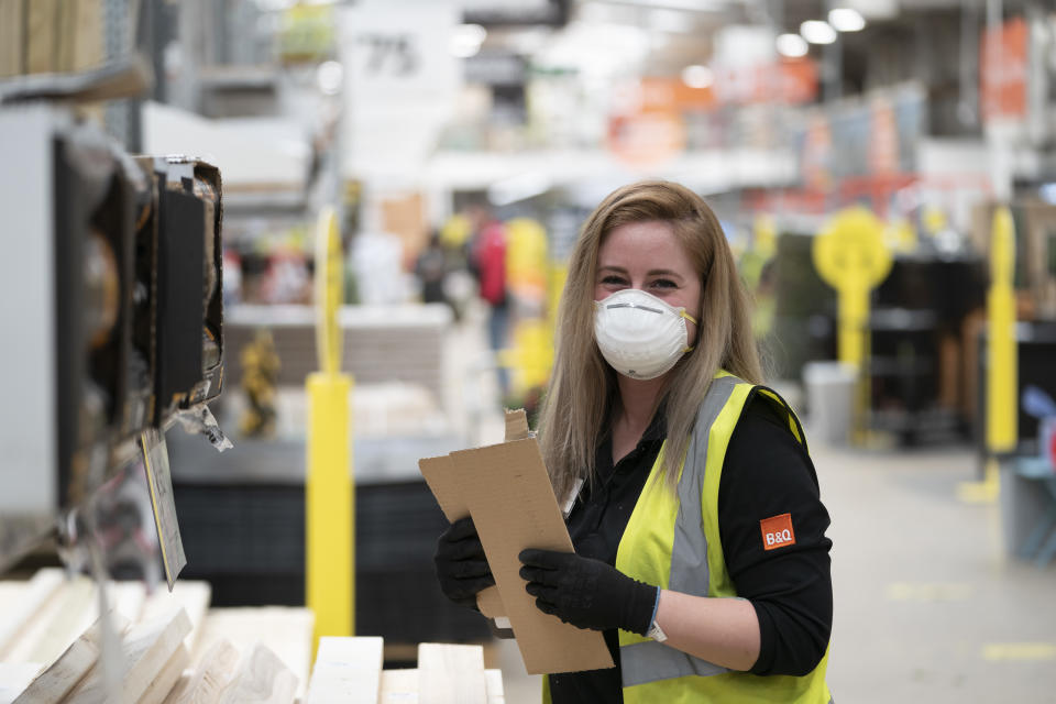 LONDON, UK - MAY 15: Staff wear protective masks after the store adopted safe measures to protect both customers and staff at home improvement store B&Q in Chiswick as lockdown restrictions start to ease after 7 weeks on May 15, 2020 in London, England. The chain, part of the Kingfisher Group was classed as an essential retailer during the coronavirus lockdown. Shops were close in March but the chain was offering “contactless” click and collect services. Now as restrictions are eased in the eighth of Lockdown, all 288 UK B&Q stores are now open. Following the example of supermarkets, B&Q is limiting the number of customers in store at any one time and has put strict social distancing measures in place. These include sanitiser stations for trolleys; safe queuing 2 metres apart before entering the store; 2 metre navigational markers on the floor and directional arrows to guide customers through the store; perspex screens at checkouts; and card and contactless payments only. The prime minister announced the general contours of a phased exit from the current lockdown, adopted nearly two months ago in an effort curb the spread of Covid-19. (Photo by Ming Yeung/Getty Images)