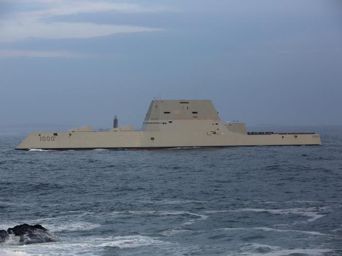 The U.S. Navy's stealth destroyer, the USS Zumwalt, passes Fort Williams State Park, with Ram Island Ledge Lighthouse in the background, on its way to Portland Harbor on Thursday, December 10, 2015.
